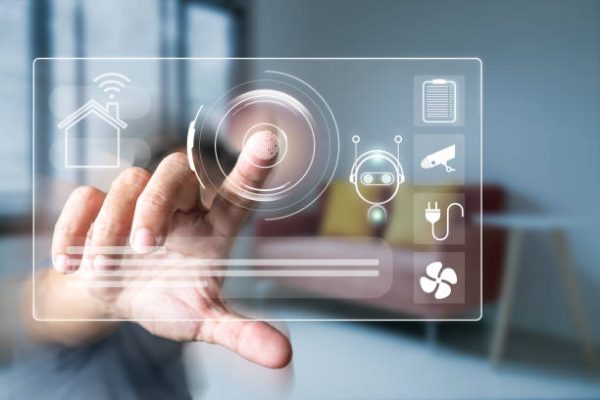 Man's finger touching the icons of smart home application on virtual screen with blurred room background. Home automation Concept